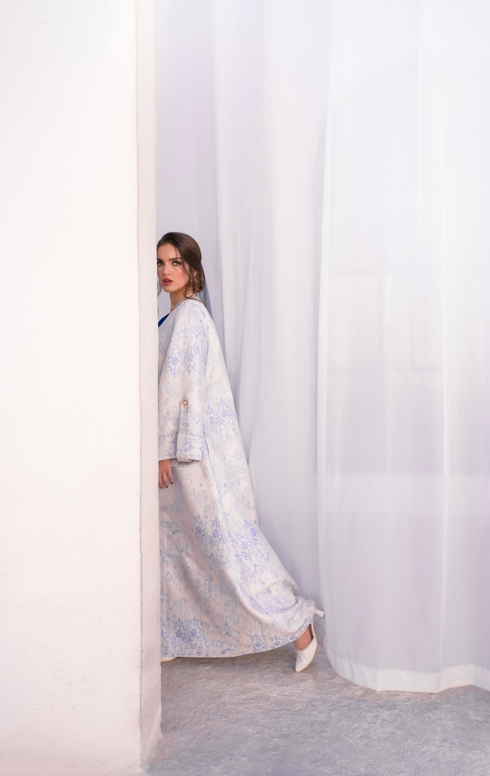 Light lilac patterned abaya in a softly lit setting