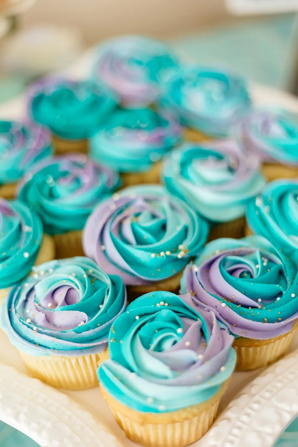 Turquoise and lavender hand-piped cupcakes